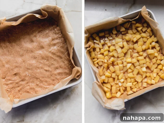 Paleo Apple Pie Bars assembled with apple filling and crumble topping, ready for baking.