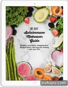 The cover of 'The 30 Day Autoimmune Makeover Guide' e-book, surrounded by fresh produce like berries, greens, and avocados, emphasizing whole foods.