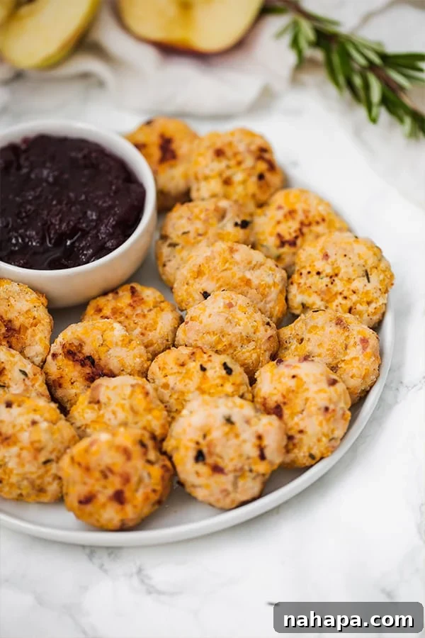 Flavorful Butternut Chicken Poppers Paleo Whole30 AIP 4 A full plate of golden-brown butternut chicken poppers surrounding a small bowl of dipping sauce.