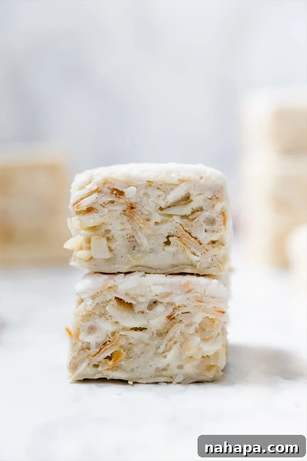 Guilt-Free Crispy Squares: Paleo & AIP Approved 6 Two grain-free "rice" crispy treats stacked on top of each other on a white background.