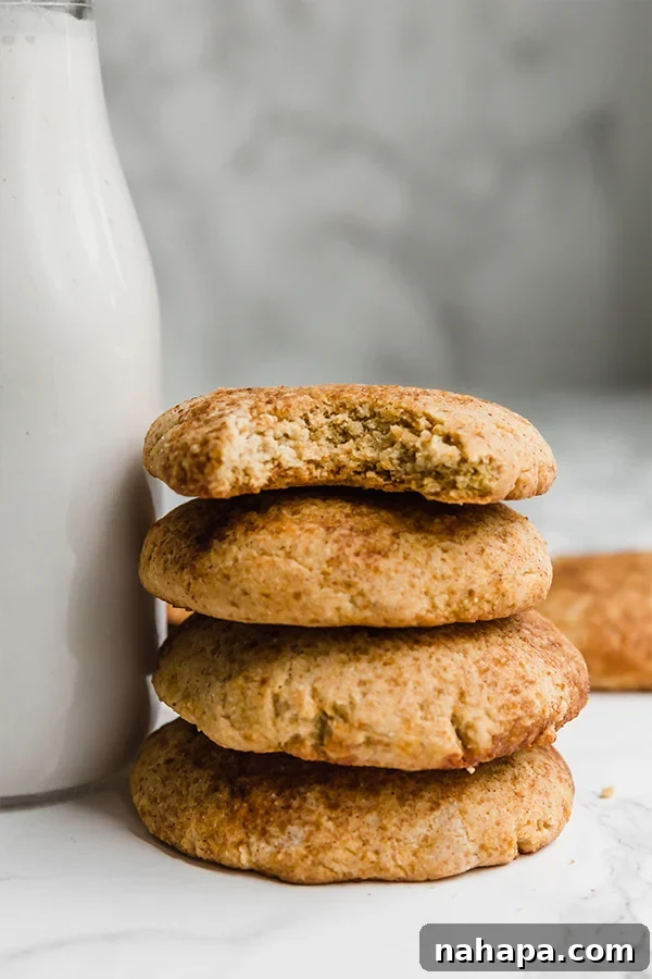 Soft and chewy pumpkin snickerdoodles with cinnamon sugar coating, a favorite fall cookie