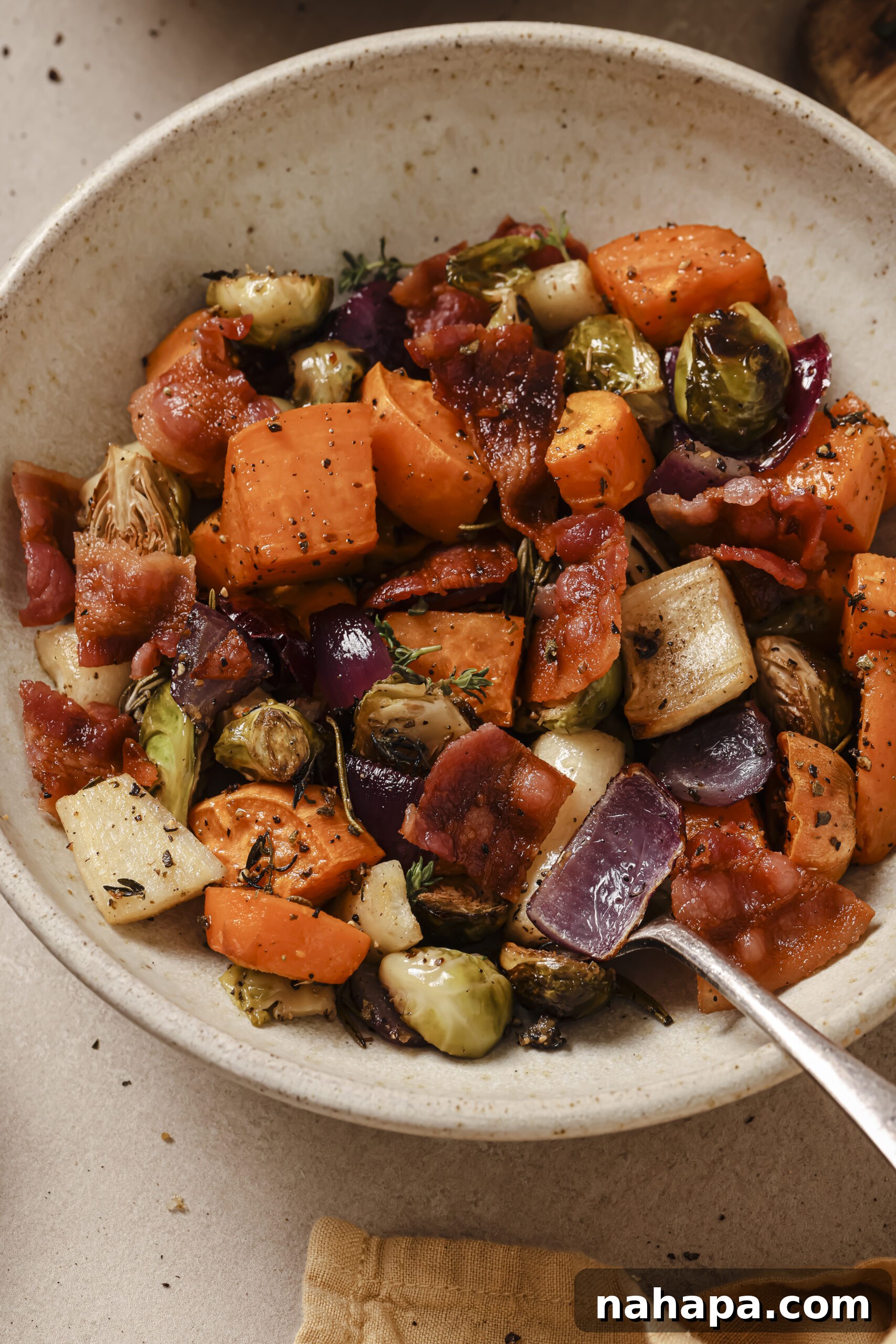 A hearty bowl of Harvest Vegetable Hash with bacon, ready to serve.