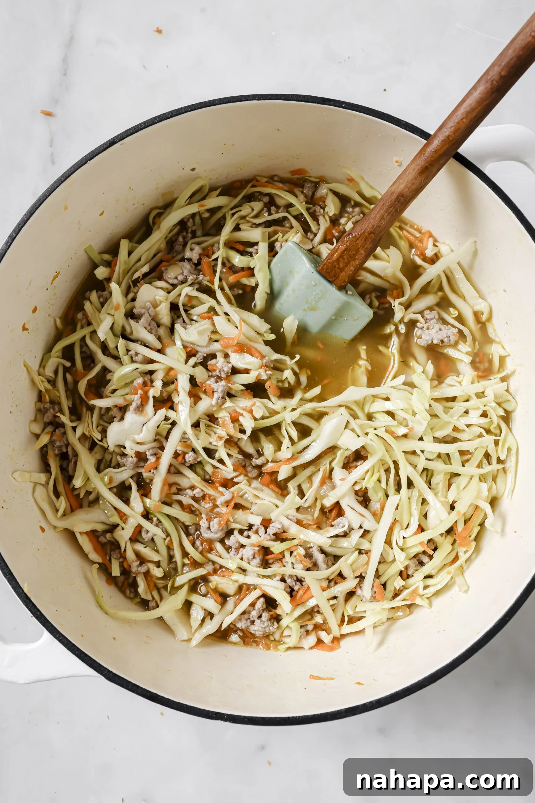 One-Pot Gluten-Free Egg Roll Soup 6 Egg roll soup in a large pot before being simmered, showing all the ingredients combined.