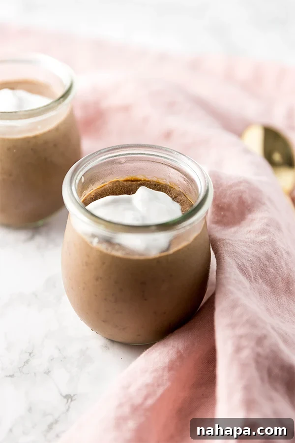 Guilt-Free Paleo Peppermint Mocha Collagen Pudding 3 Two servings of peppermint mocha collagen pudding, garnished with whipped coconut cream and chocolate shavings.