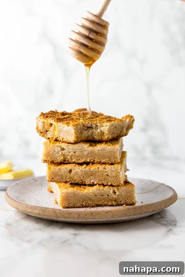 A close-up shot of grain-free cornbread squares with visible crumbly texture.