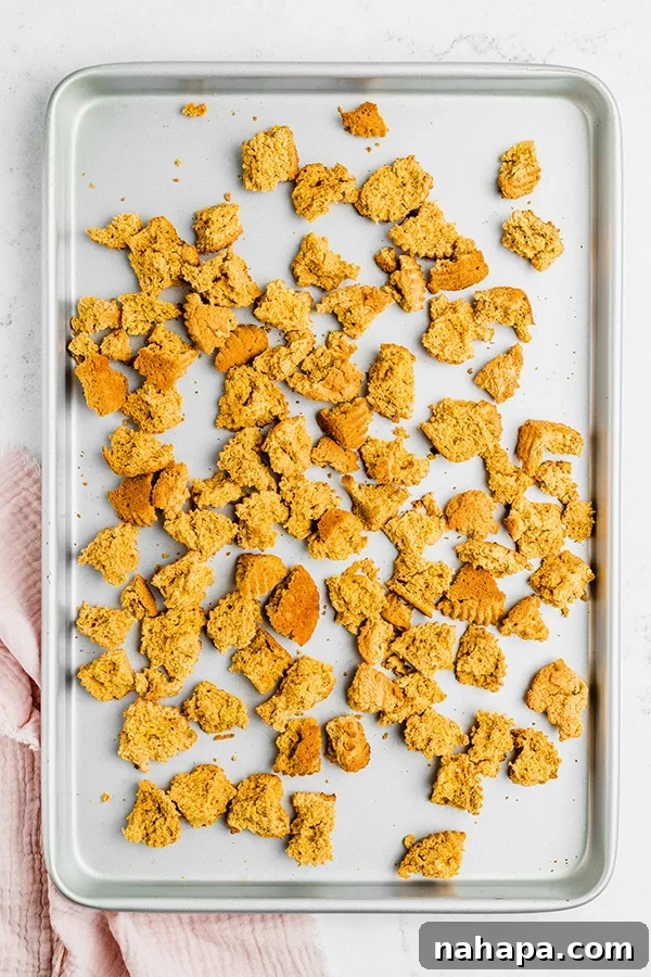 Hearty Paleo Thanksgiving Cornbread Stuffing AIP and Grain Free 4 A baking sheet with torn bread.
