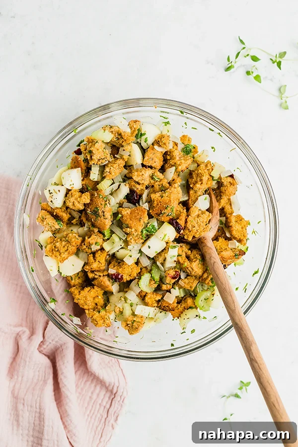 Hearty Paleo Thanksgiving Cornbread Stuffing AIP and Grain Free 5 A mixing bowl with ingredients for cornbread stuffing.