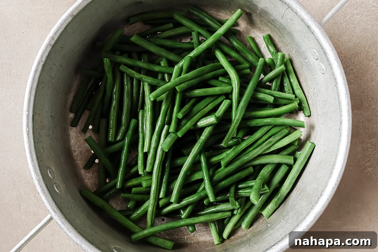 Comforting Gluten Free Green Bean Bake 6 Green beans in a pot with cream of mushroom soup.