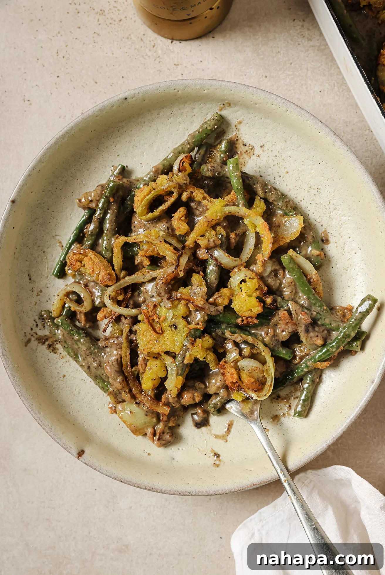 Comforting Gluten Free Green Bean Bake 10 A serving of bean casserole on a plate.