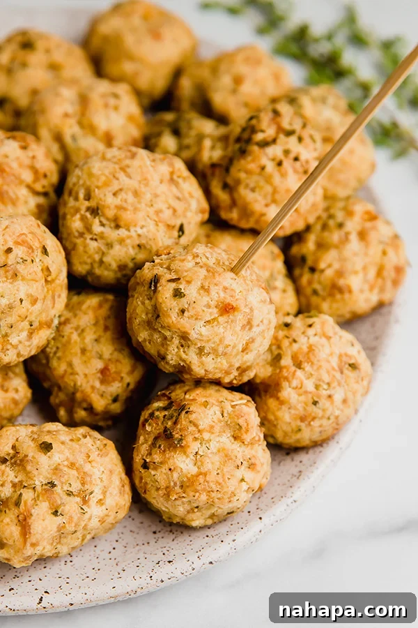 Paleo Sausage Balls, golden brown and perfectly bite-sized, arranged on a platter ready to be served as an appetizer.