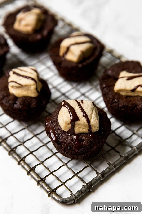 A wire rack with hot chocolate cookie cups on it.