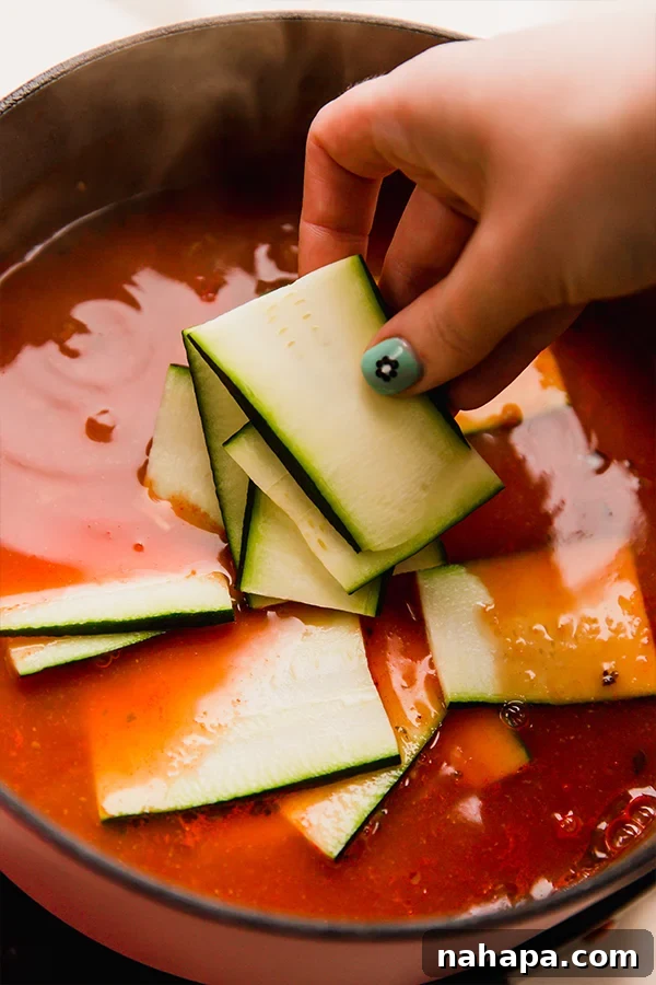 Paleo Lasagna Soup: Clean Eating Comfort 4 Rich, simmering Paleo Lasagna Soup with ground meat, sauce, and zucchini noodles