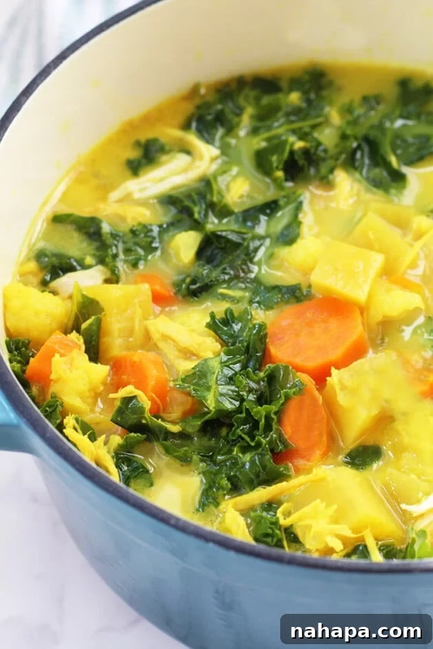 My 2018 Recap: Reader Favorites and Personal Reflections 2 A bowl of vibrant Anti-inflammatory Turmeric Chicken Soup garnished with fresh herbs.