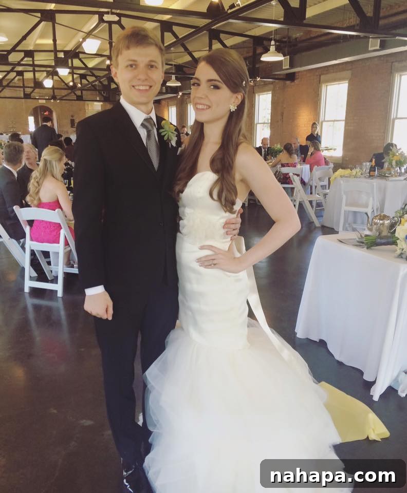 Michelle and Daniel at their wedding, smiling brightly.