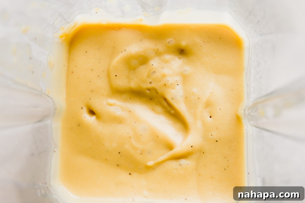 Creamy Cashew-Free Vegan Queso 7 Vegan queso blended in a blender.
