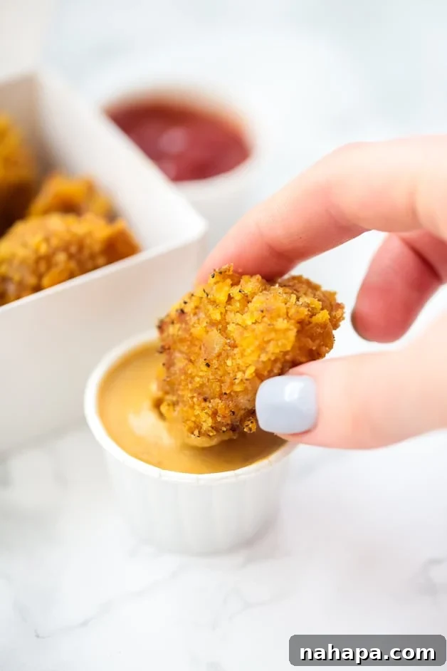 Perfectly crispy paleo chicken nuggets, a healthy and AIP-compliant Chick-Fil-A copycat, ready for dipping.
