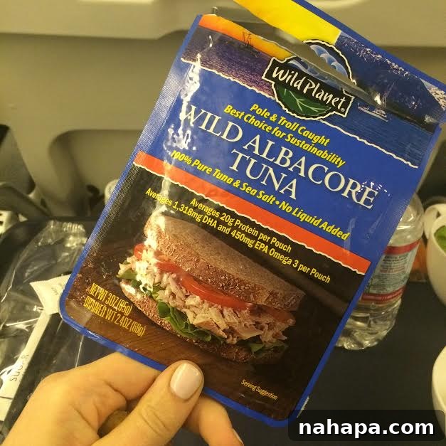 A selection of healthy, packed food for air travel, including prepared vegetables and protein, emphasizing the importance of foresight for restricted diets.