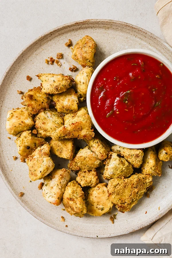 Baked crispy chicken nuggets on a baking sheet