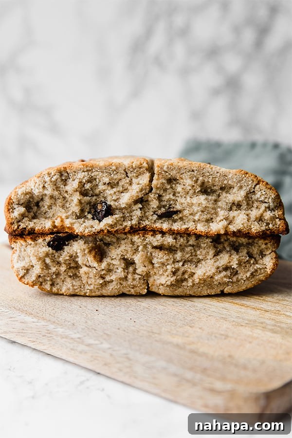 Two generous slices of Irish soda bread, beautifully golden and inviting, stacked on top of two others.
