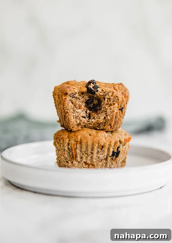Irresistible AIP Paleo Gluten Free Carrot Cake Muffins 4 Two carrot cake muffins.