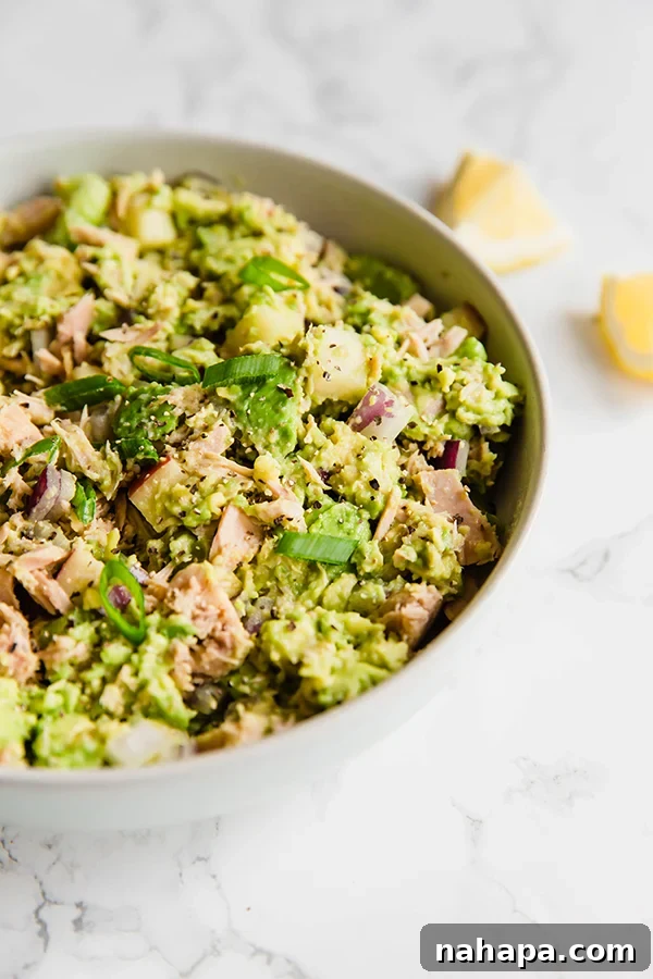 Three different ways to serve avocado tuna salad: by itself, on sweet potato toast, and in a lettuce wrap.
