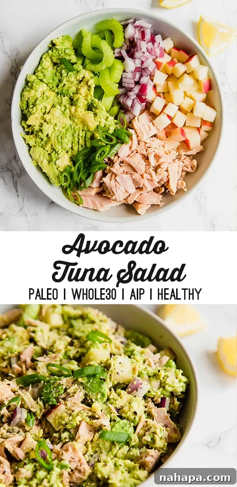 Avocado tuna salad served in a bowl, surrounded by fresh ingredients.