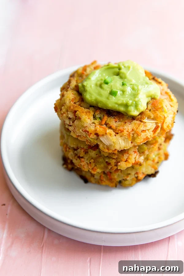 Close-up of golden-brown Carrot Bacon Breakfast Fritters, showcasing their crispy edges and inviting texture, ideal for paleo, whole30, and AIP diets.