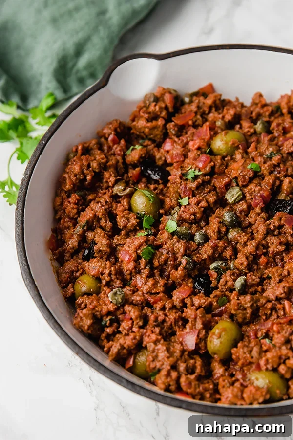 Cuban Picadillo served alongside cauliflower rice, showcasing a healthy and delicious meal.