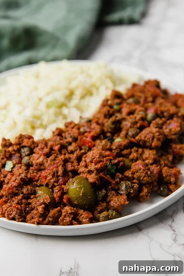 A close-up of Cuban Picadillo with cauliflower rice, beautifully plated for a wholesome meal.