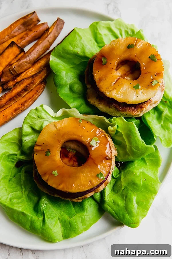 Paleo Whole30 AIP Tropical Teriyaki Chicken Burgers 3 Delicious Hawaiian Teriyaki Chicken Burgers, made with ground chicken and fresh toppings, ready for grilling.
