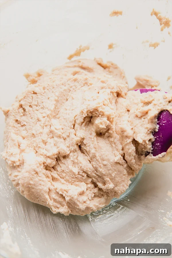 Shortcake batter being prepared in a bowl, showing a smooth, creamy texture.