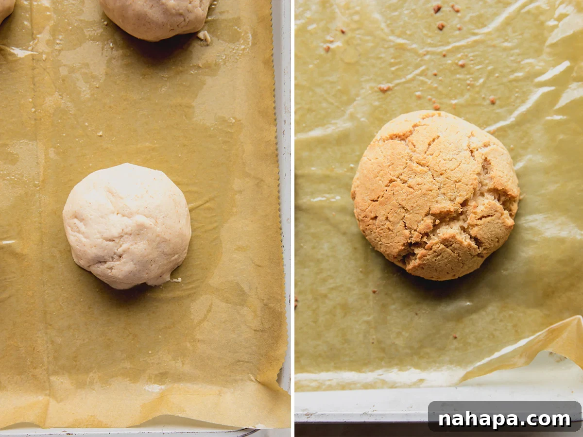 Four small, round shortcakes placed on a parchment-lined baking sheet, ready for baking.