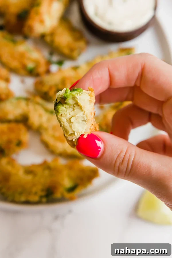 Close-up shot of baked avocado fries with a perfectly crispy coating