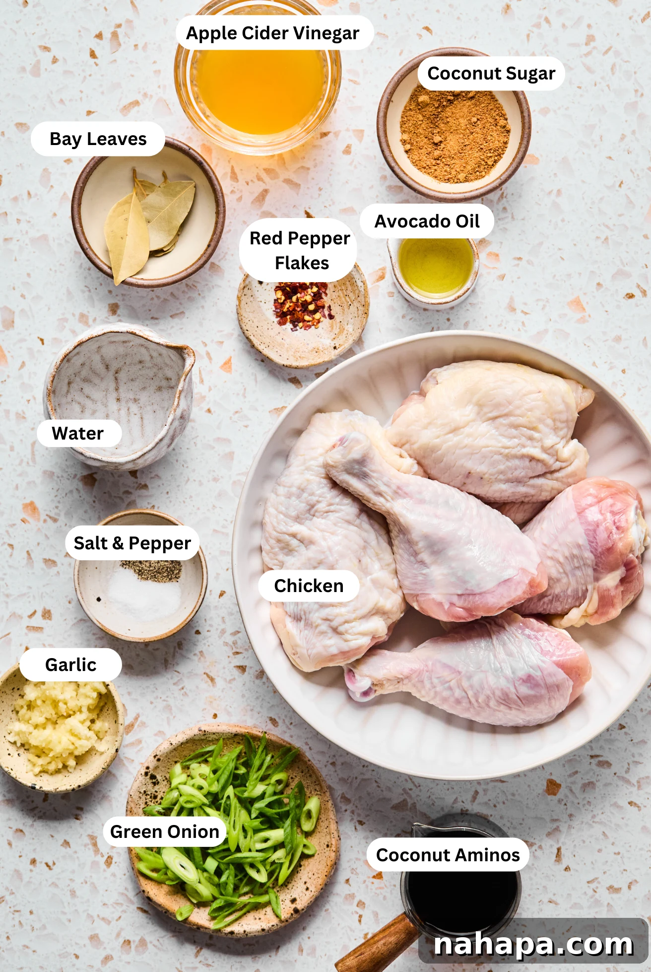 All the ingredients to make Gluten-Free Chicken Adobo laid out in bowls.