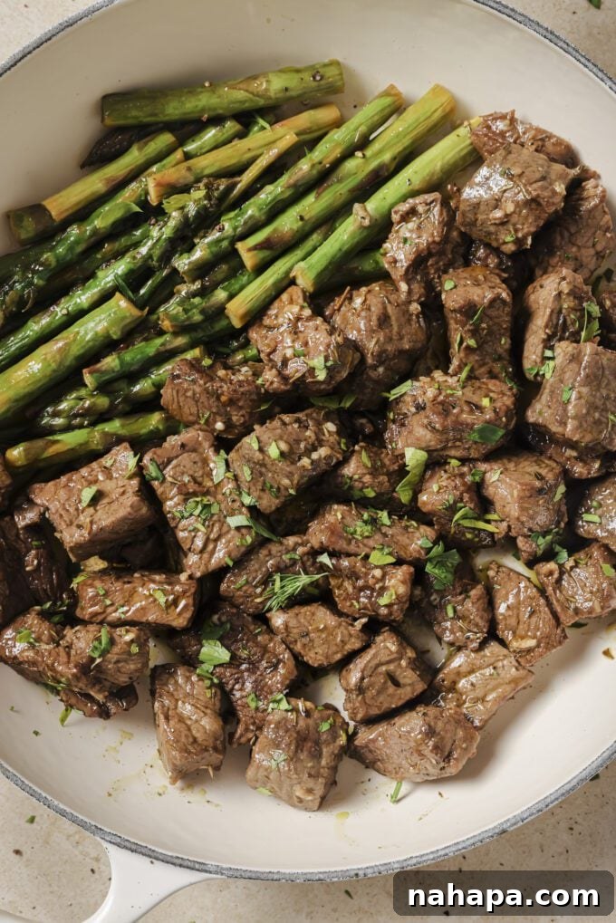Garlic Balsamic Steak Bites with Asparagus served on a plate