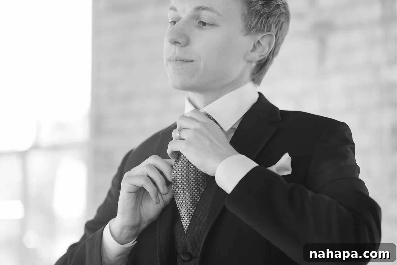A Paleo Perfection: Our Wedding Crepe Cake and Unforgettable Day 5 Groom in a classic black tuxedo with a grey tie.
