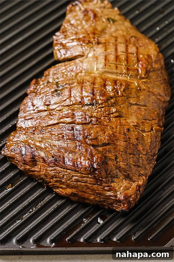 Carne Asada being removed from the grill