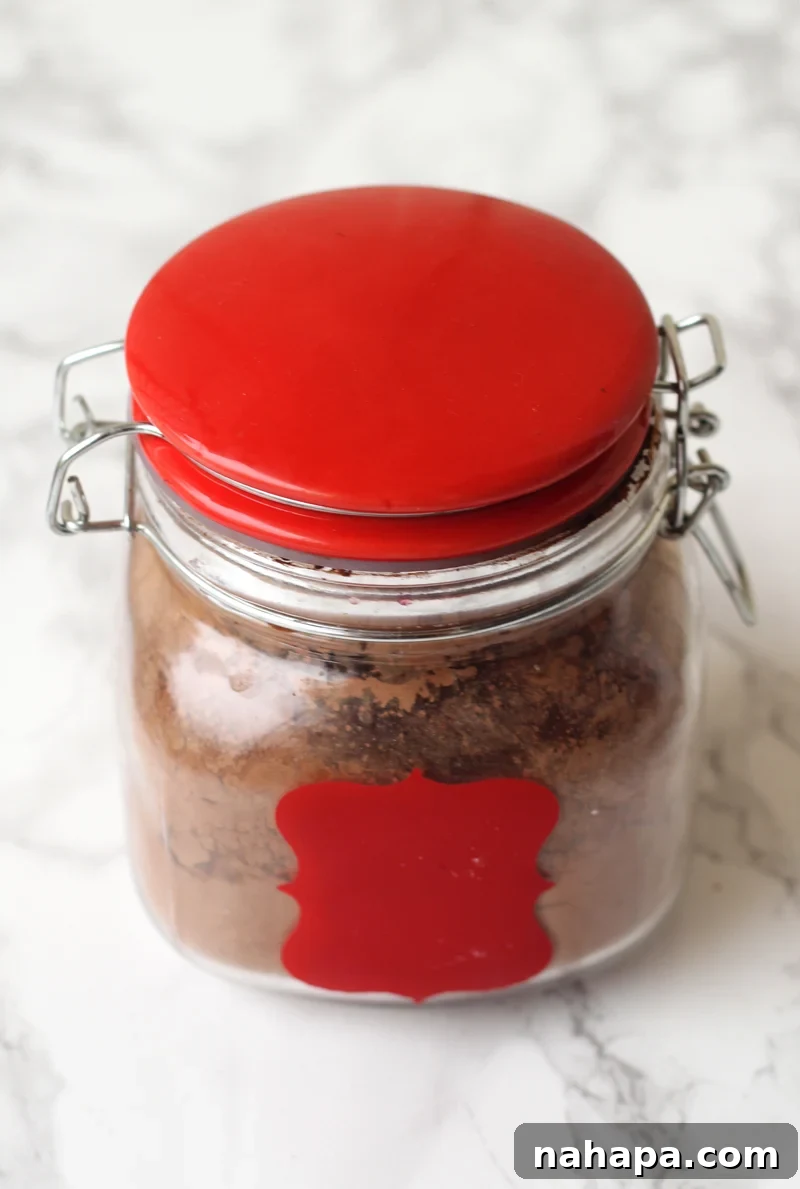 Hot chocolate in a white and red canister. 