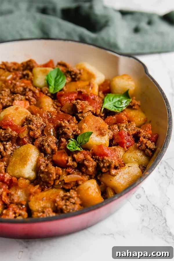 Ingredients for healthy cauliflower gnocchi bolognese laid out on a table.