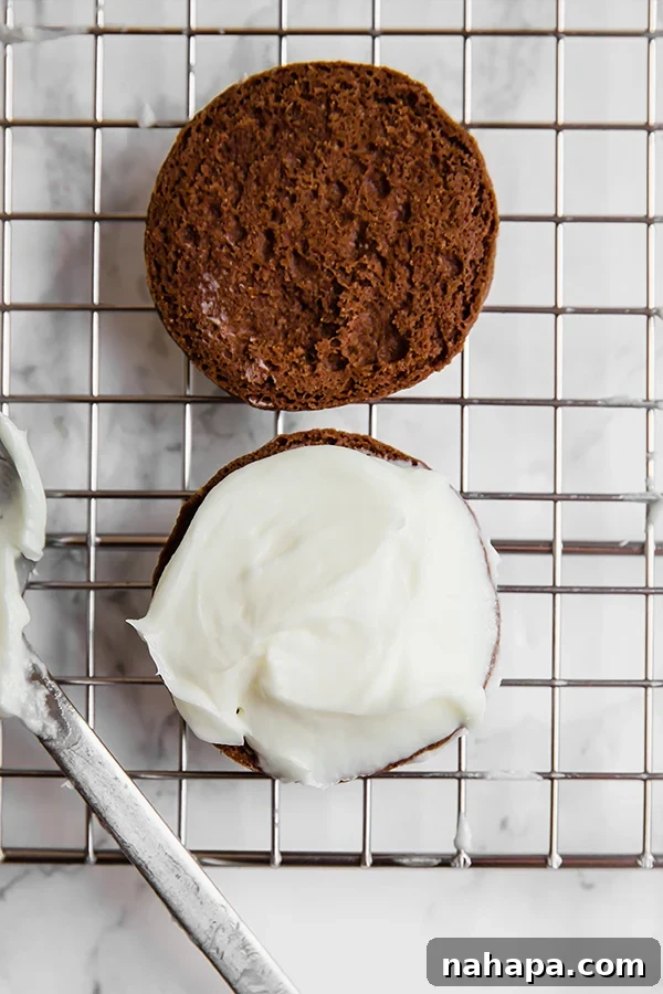 Homemade Oreo cookies with creamy filling showing off the texture and how perfectly sandwiched they are.