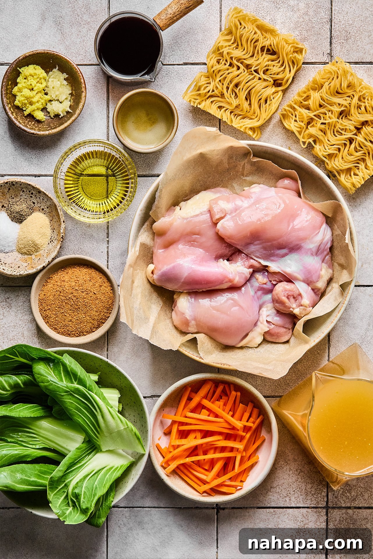 All the fresh ingredients required to prepare a batch of chicken teriyaki ramen, neatly laid out on a clean surface before cooking begins.