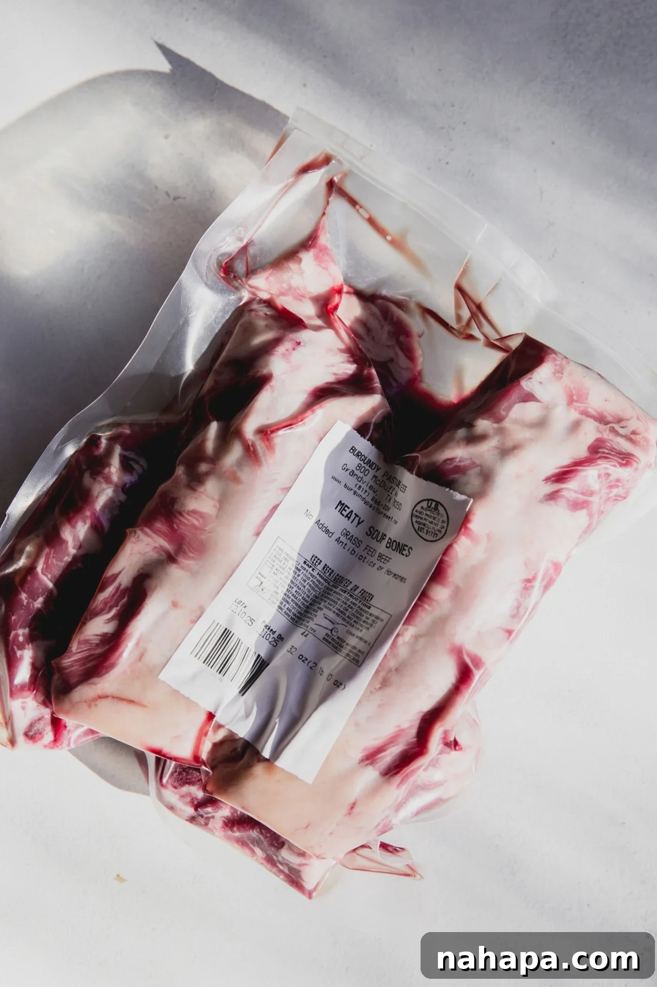 Meaty beef soup bones, often found wrapped for sale at local butchers, ready for broth making.
