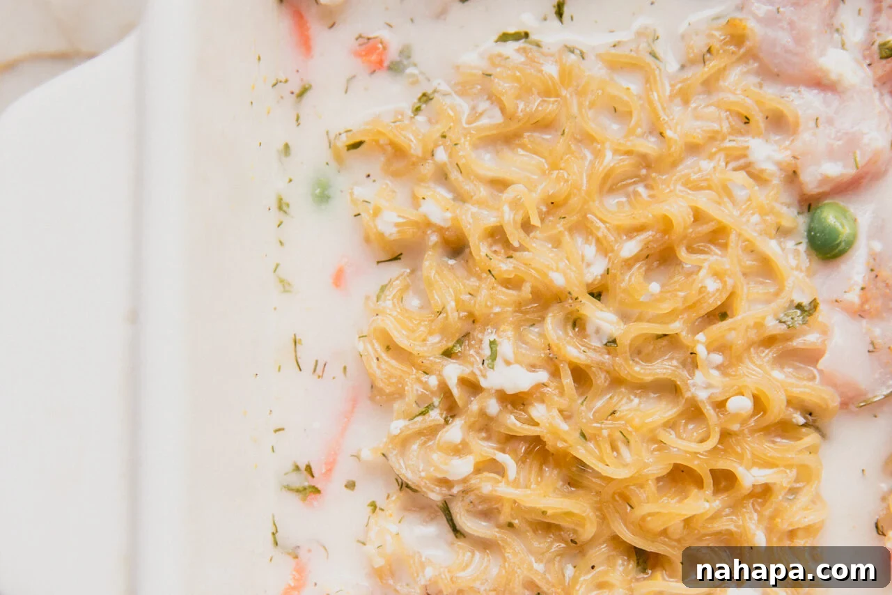 The casserole dish with coconut milk and cream cheese added to the ramen vegetables and chicken.