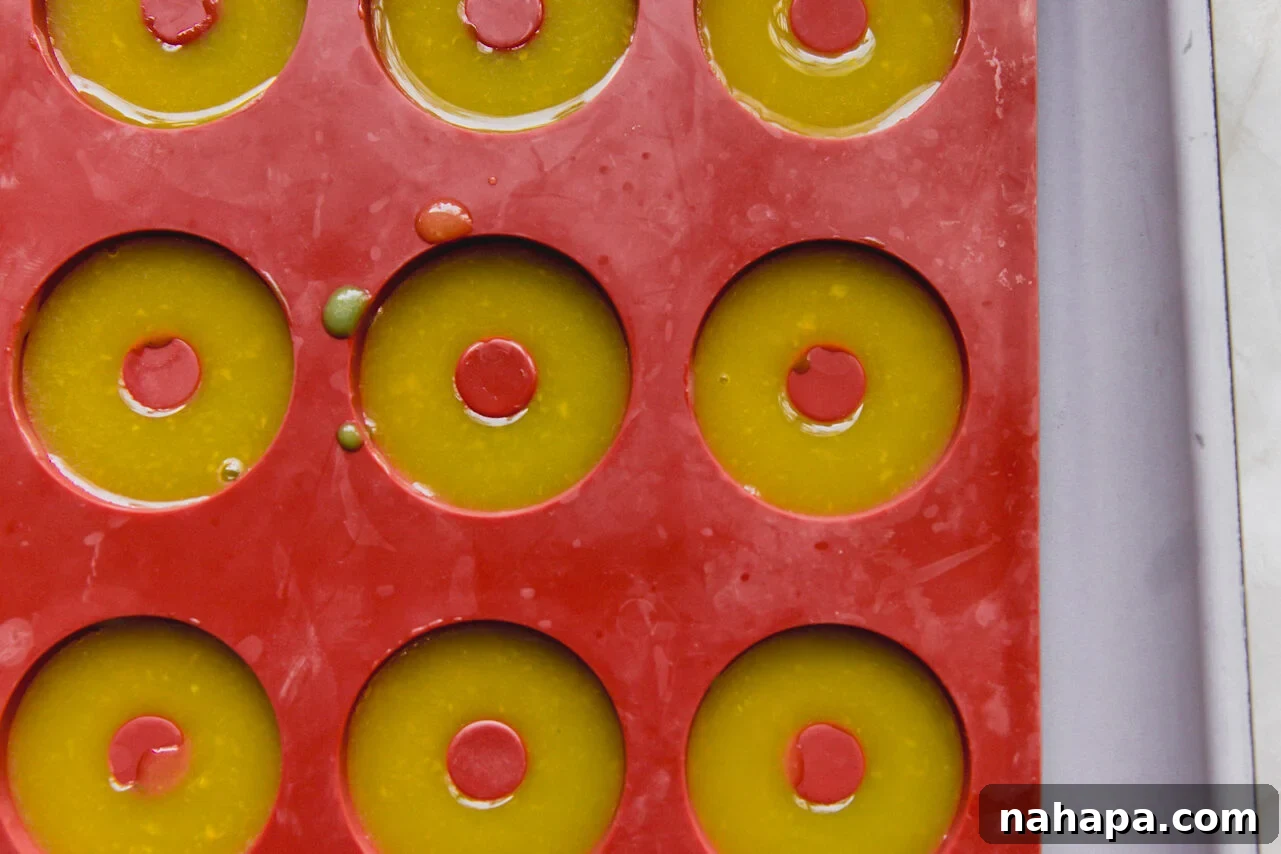 A mold filled with the orange mango mixture before refrigerating.
