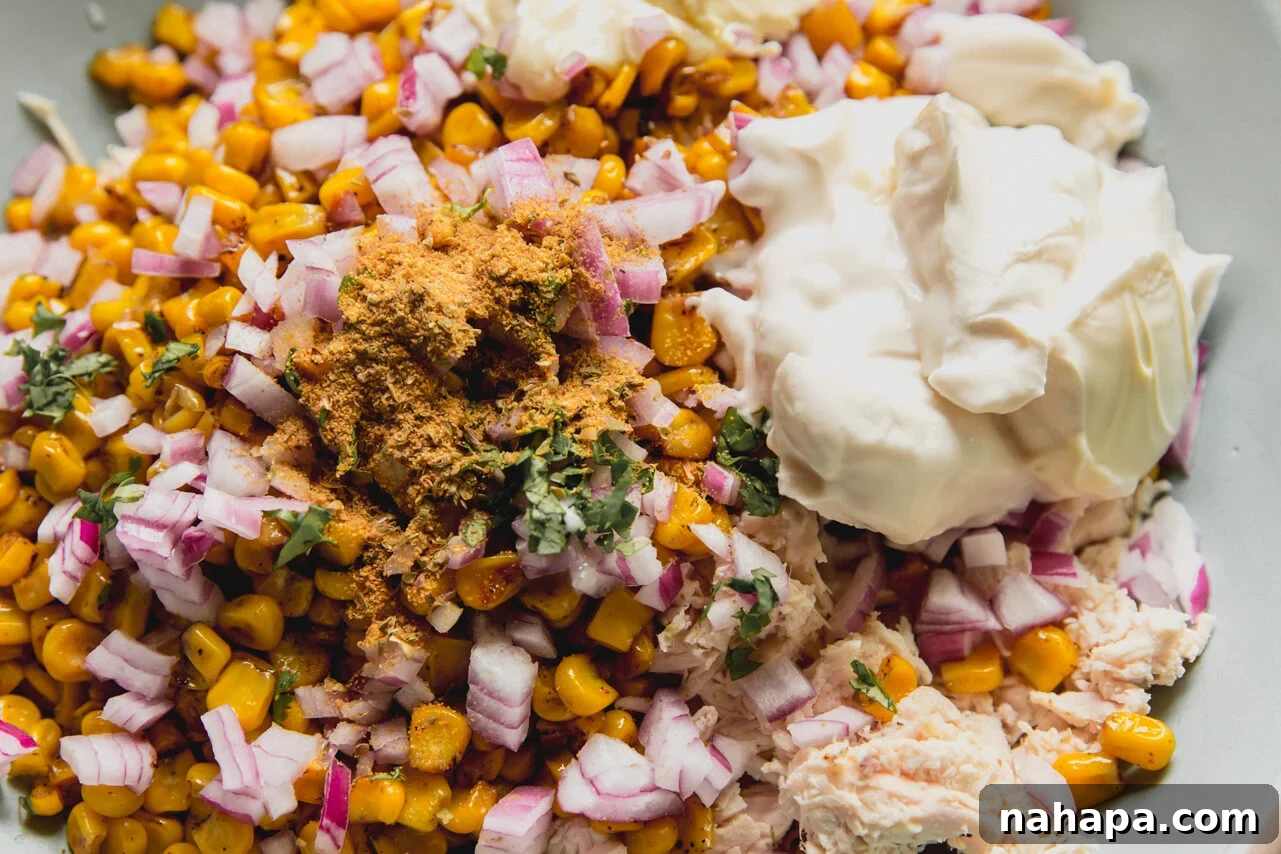 Mexican Street Corn Chicken Salad Recipe for Summer BBQs 6 A bowl filled with all the ingredients to make street corn chicken salad before combining.