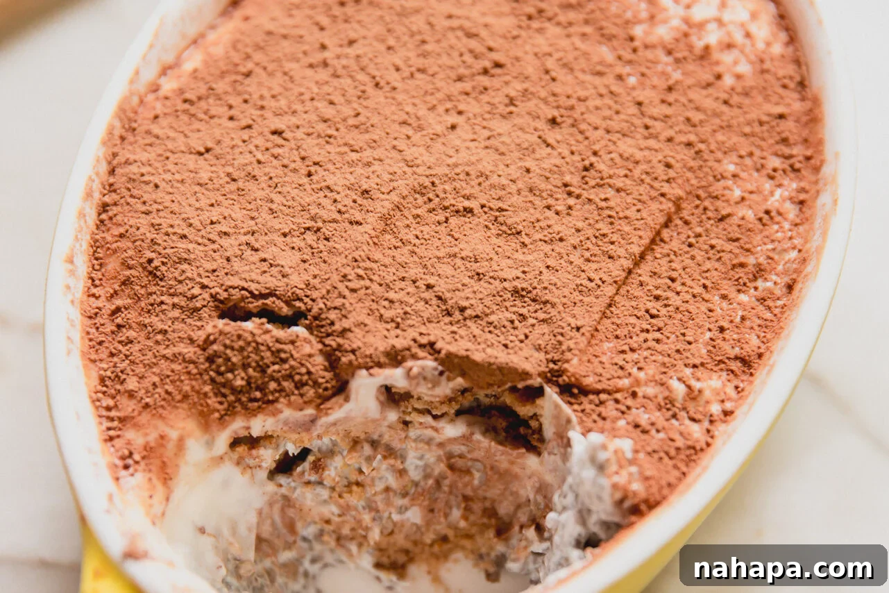 Protein tiramisu in a small yellow dish.