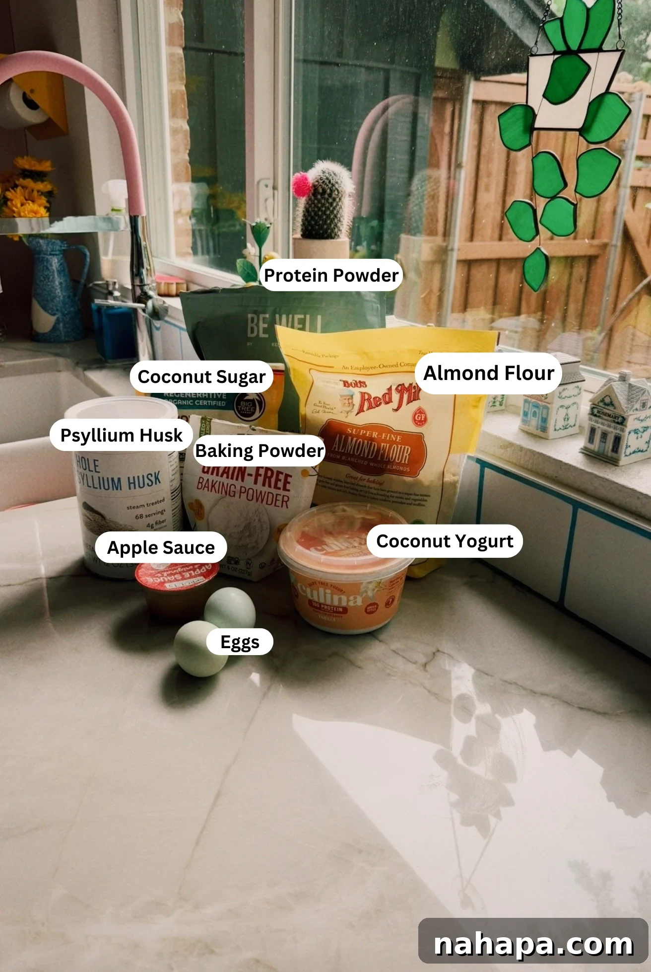 The ingredients to make high protein muffins on a counter before baking begins.