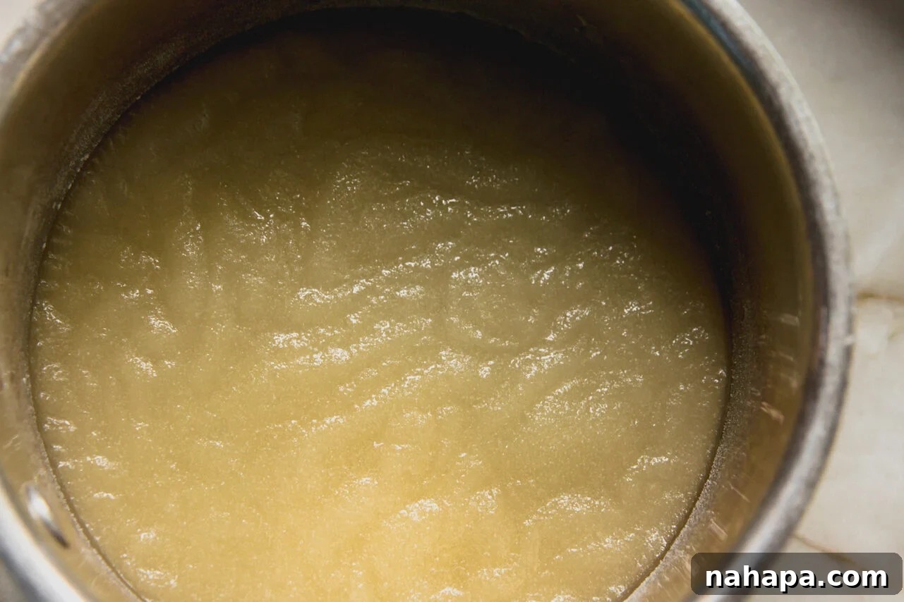 A pot filled with pickle gelatin mixture that is not liquid yet.
