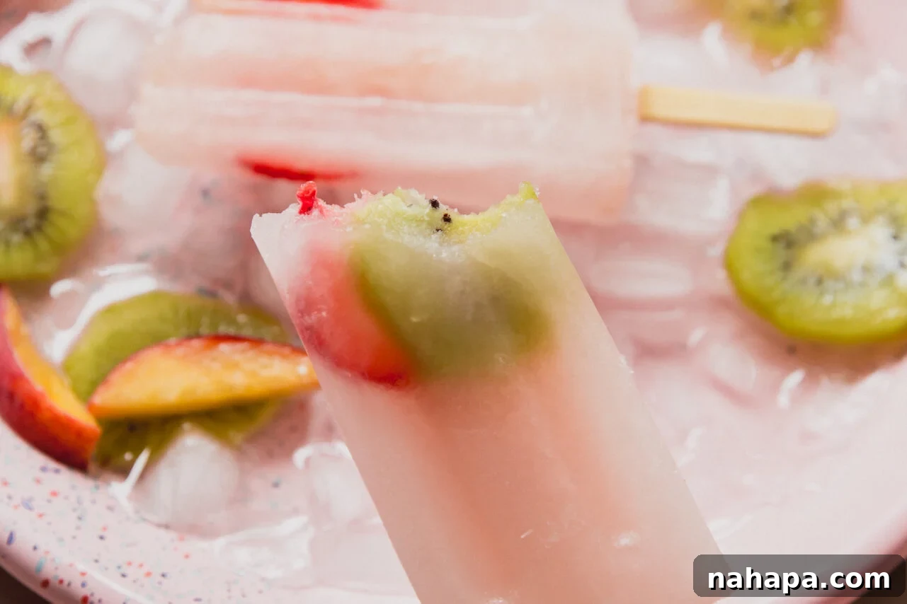 A popsicle after being frozen with a bite taken out of it.