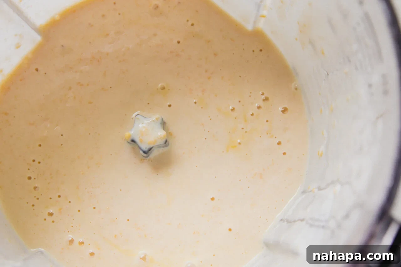 Mango chia pudding ingredients blended in a food processor
